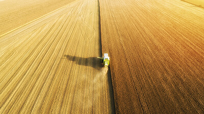 Aerial view of a truck harvesting a field